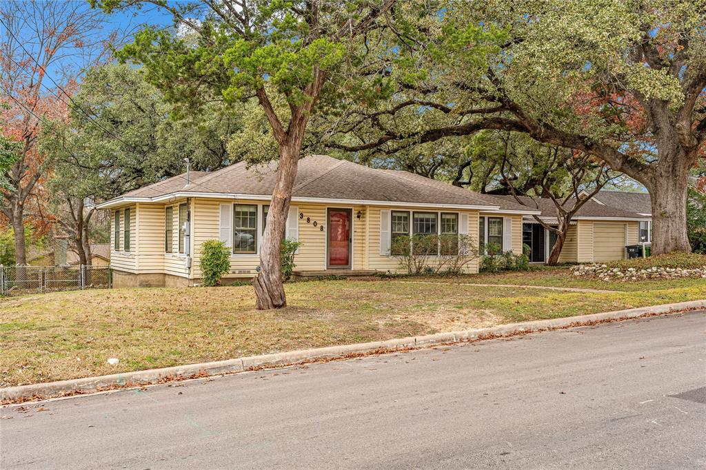 3808 North 27th Street Waco, TX 76708 - Photo 13 of 39 a front view of a house with a garden