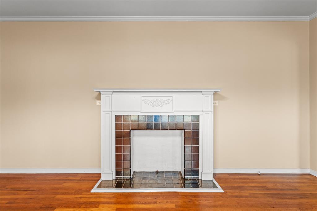 3808 North 27th Street Waco, TX 76708 - Photo 2 of 39 a view of a livingroom with wooden floor and a fireplace