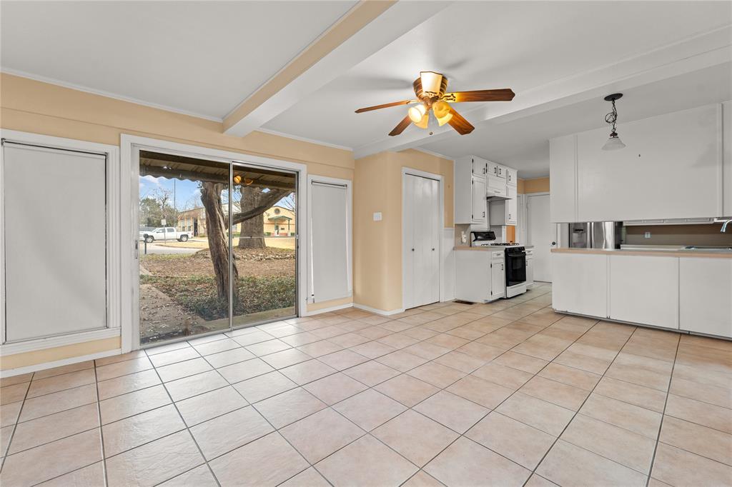 3808 North 27th Street Waco, TX 76708 - Photo 5 of 39 a view of a kitchen with cabinet and a chandelier fan