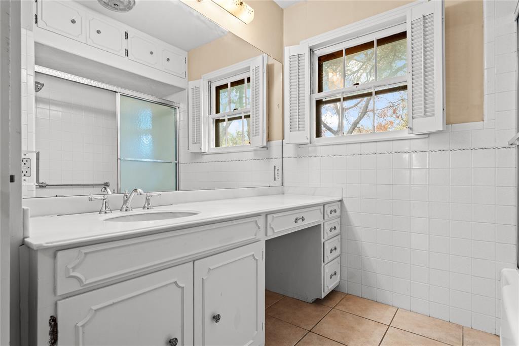 3808 North 27th Street Waco, TX 76708 - Photo 7 of 39 a spacious bathroom with a granite countertop sink mirror and double