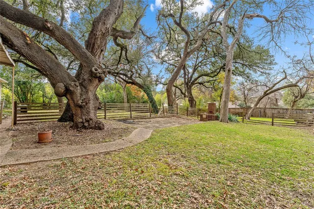 a view of outdoor space with deck and trees