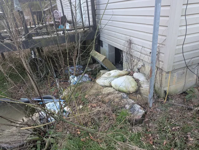 a backyard of a house with outdoor seating