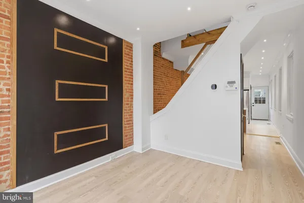 a view of livingroom with wooden floor