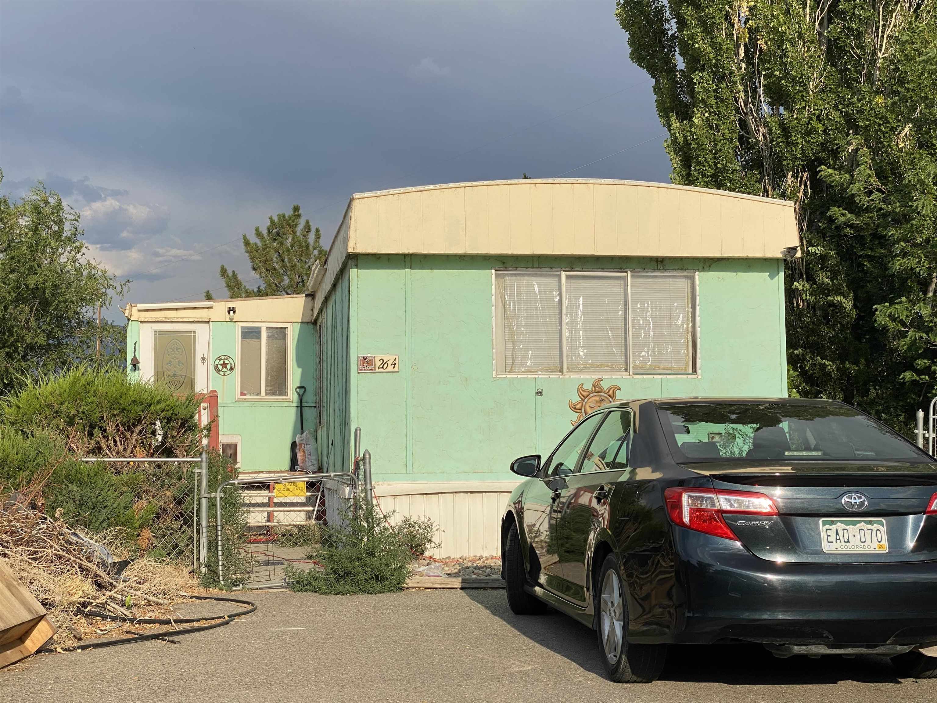 424 32 Road, Unit 264 Clifton, CO 81520 - Photo 1 of 1 a car parked in front of a house