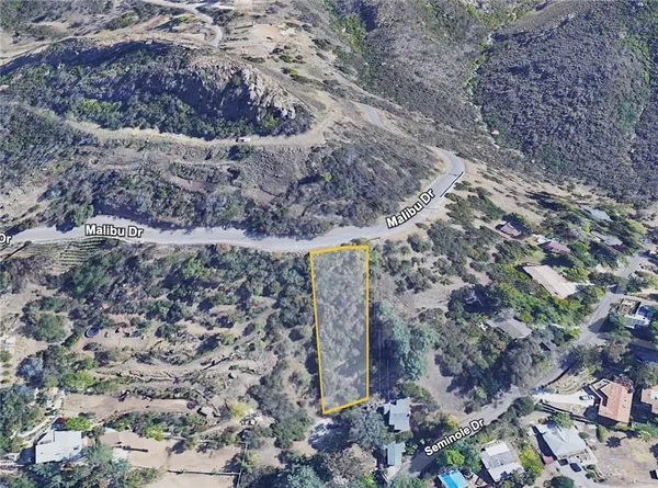 a aerial view of a house with a yard