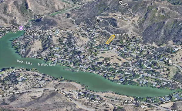 a view of lake with green space