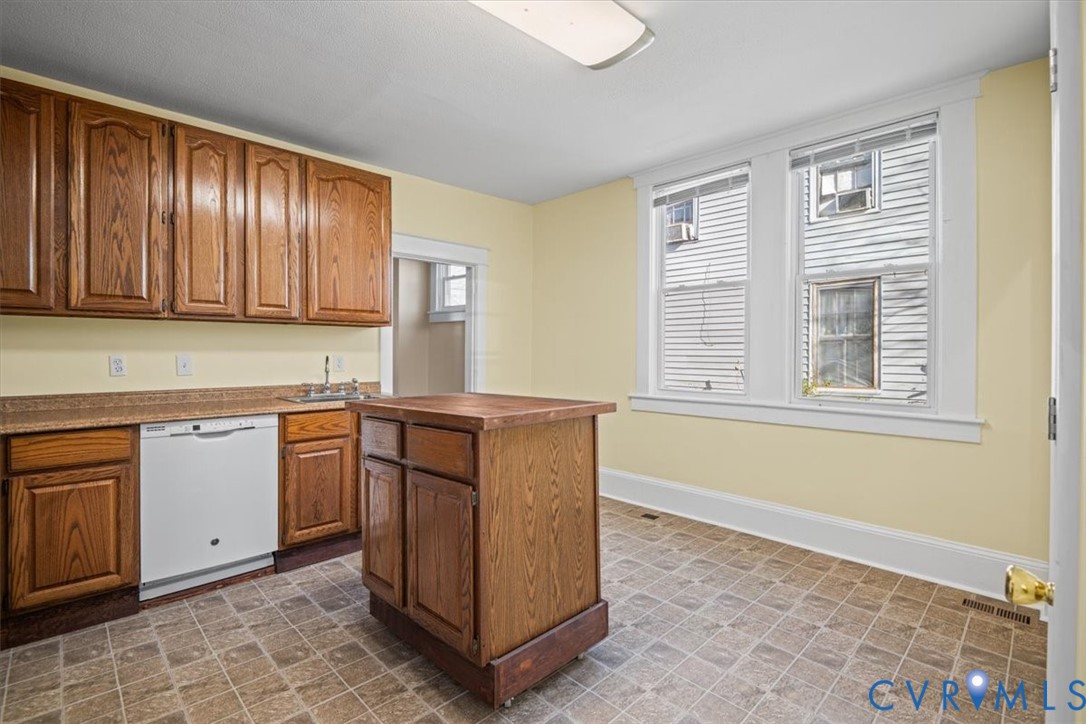 235 Lafayette Avenue Colonial Heights, VA 23834 - Photo 12 of 31 a kitchen with granite countertop cabinets and window