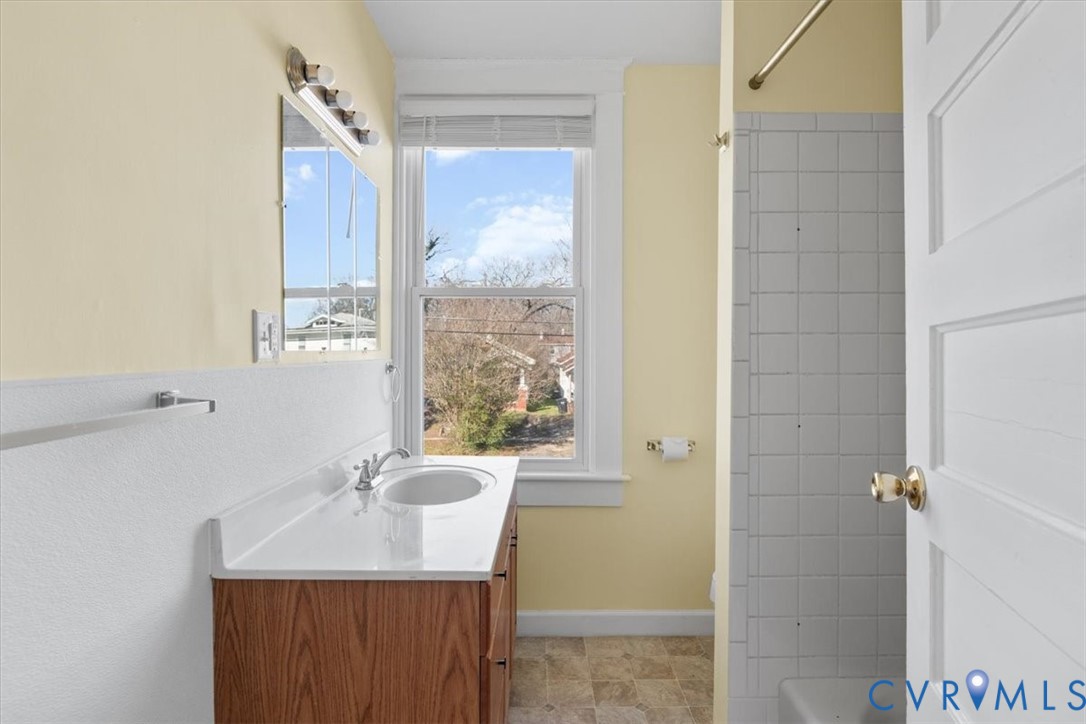 235 Lafayette Avenue Colonial Heights, VA 23834 - Photo 27 of 31 a bathroom with a granite countertop sink and a mirror