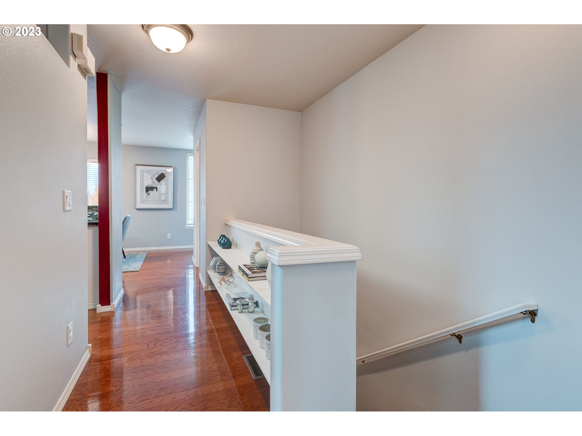 8255 Southwest Seneca Street Tualatin, OR 97062 - Photo 11 of 41 a view of a hallway with wooden floor and closet