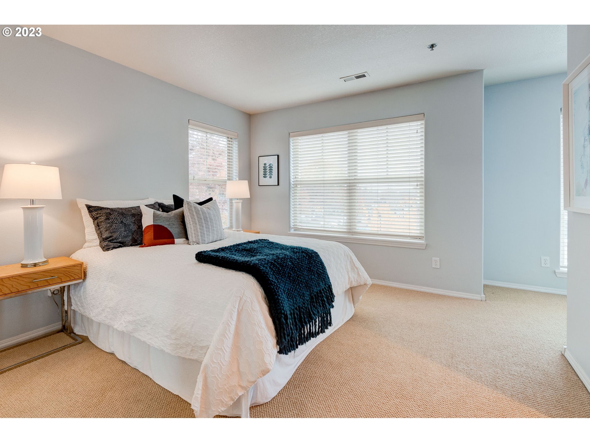 8255 Southwest Seneca Street Tualatin, OR 97062 - Photo 23 of 41 a bedroom with a bed and window