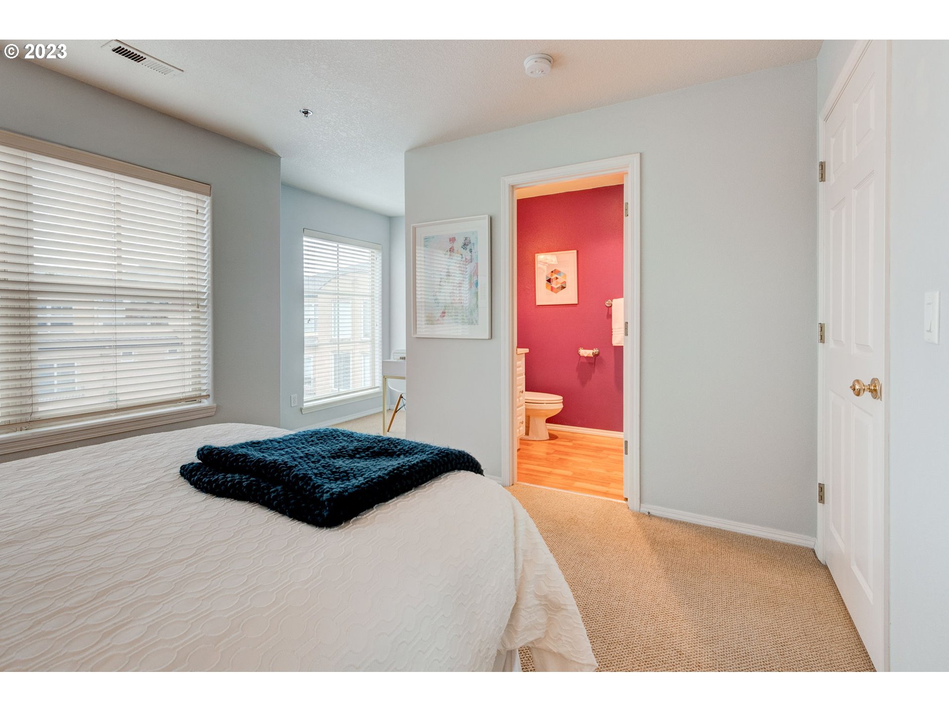 8255 Southwest Seneca Street Tualatin, OR 97062 - Photo 24 of 41 a bedroom with a bed and a window