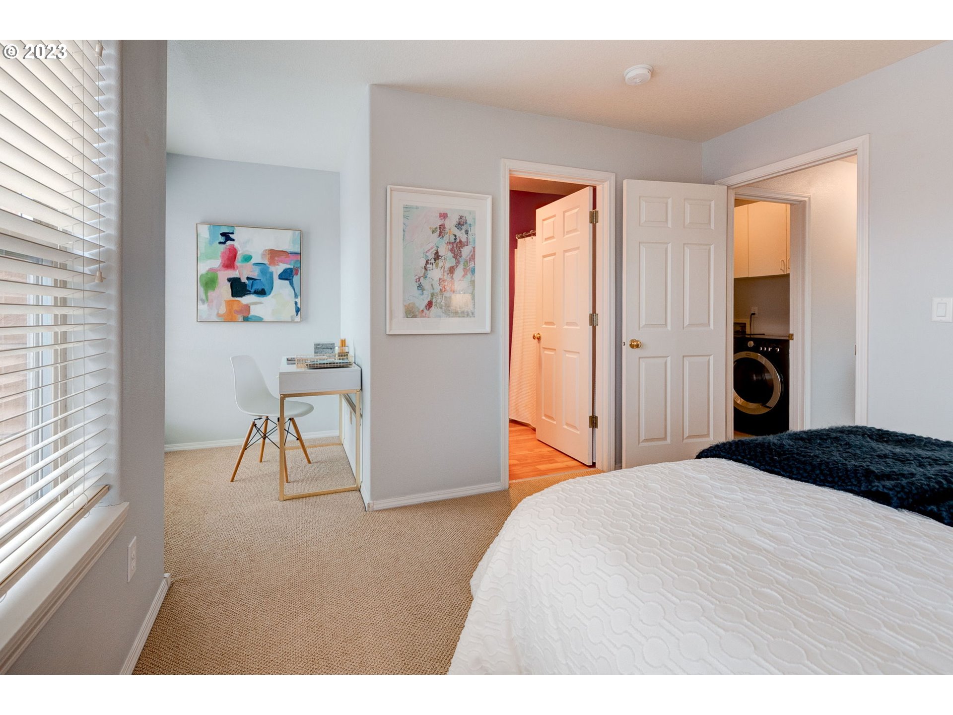 8255 Southwest Seneca Street Tualatin, OR 97062 - Photo 26 of 41 a bedroom with a bed and a painting on the wall