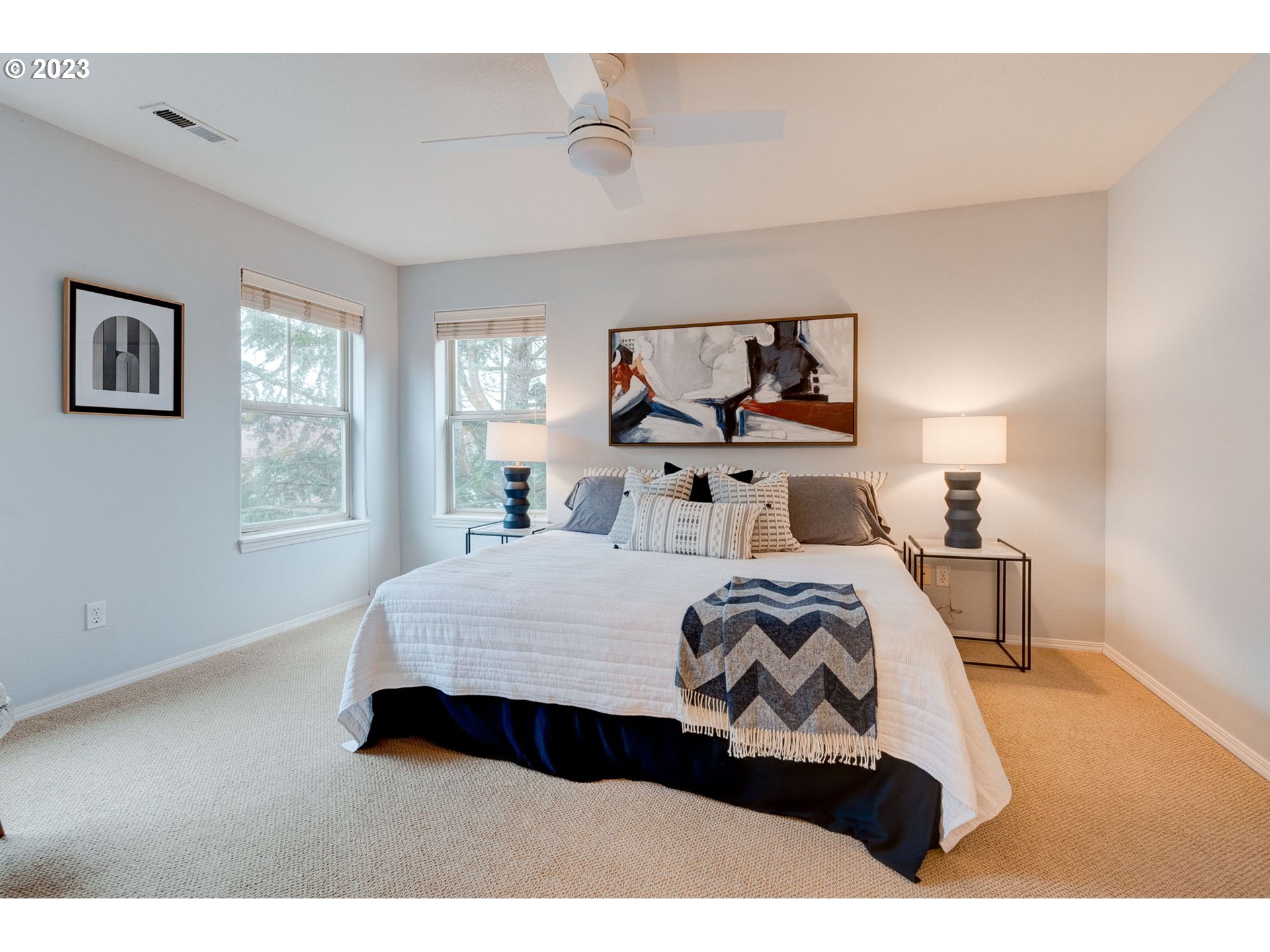 8255 Southwest Seneca Street Tualatin, OR 97062 - Photo 31 of 41 a bedroom with a bed and window