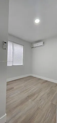a view of a kitchen with appliances and cabinets