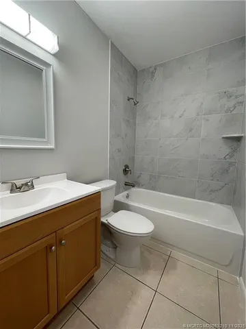 a bathroom with a sink a toilet and bathtub