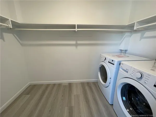 a view of storage and utility room with washer and dryer