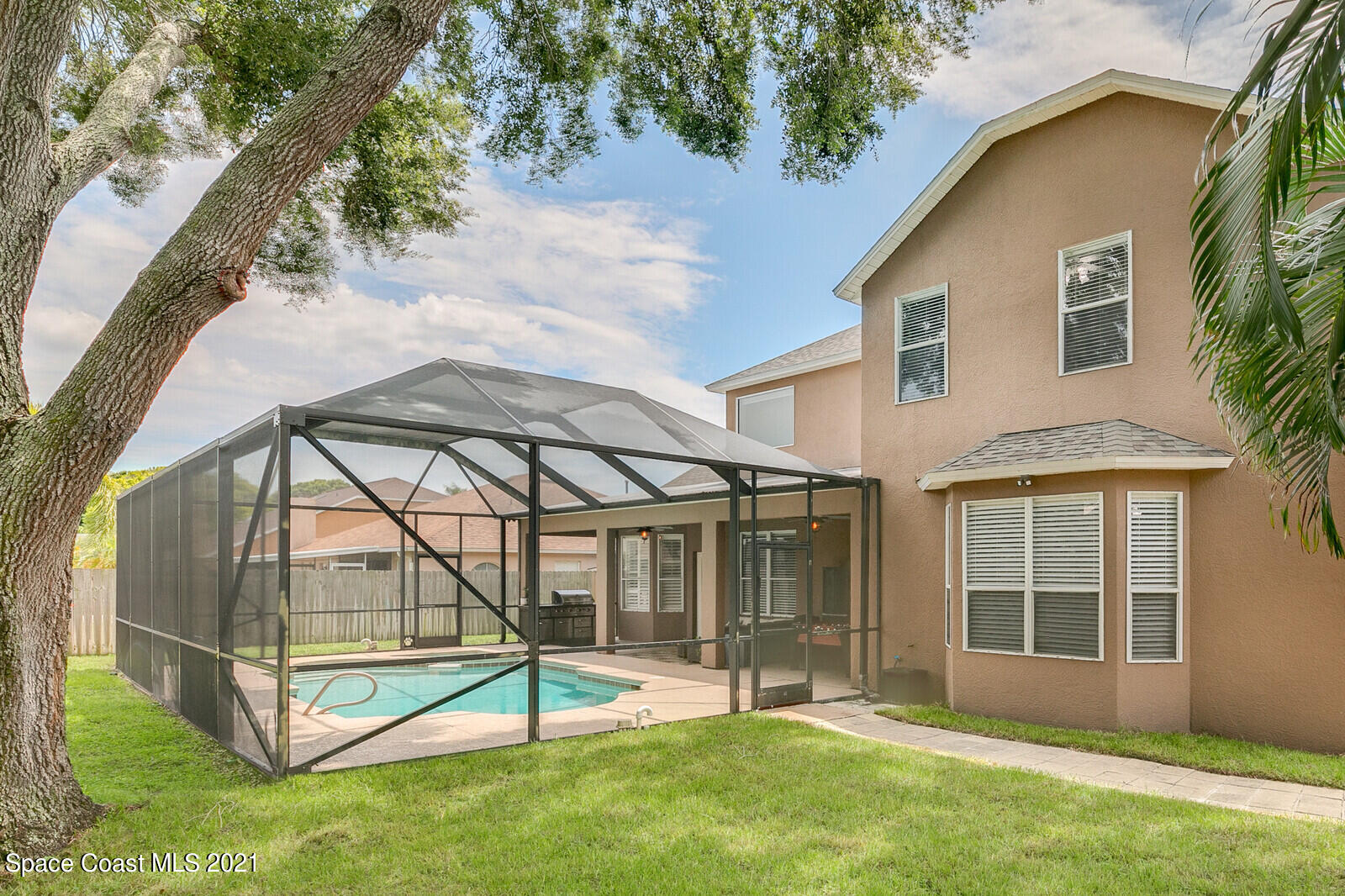 4805 Springwater Circle Melbourne, FL 32940 - Photo 3 of 36 Yard and screened pool