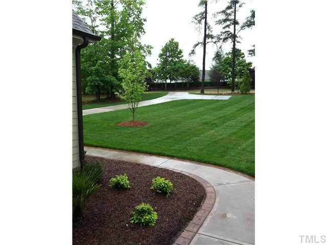 7628 Pinecrest Road Raleigh, NC 27613 - Photo 2 of 25 Professionally Landscaped & Well Manicured Exterior Front