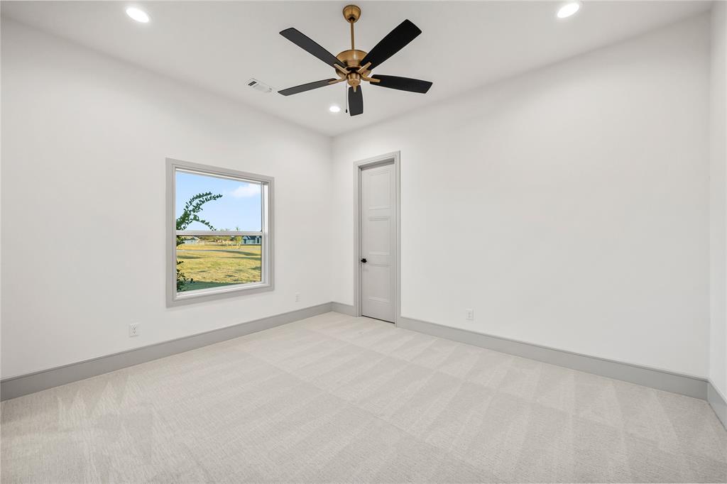 724 Cooper Trail Weatherford, TX 76087 - Photo 21 of 37 Bright interior space featuring a ceiling fan with bronze hardware, recessed lighting, and light-toned carpeting