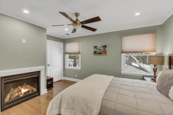 a bedroom with a bed and a fireplace