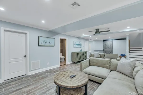 a living room with furniture and a table
