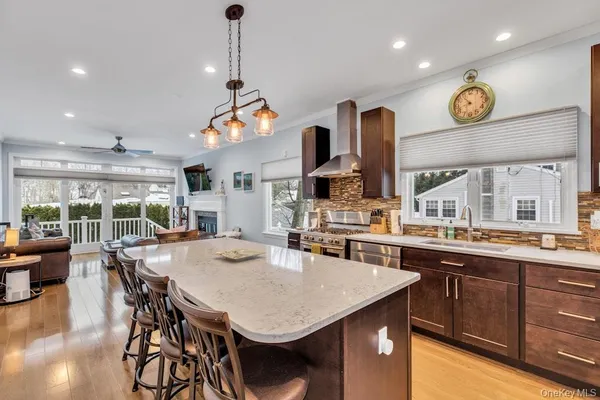 a large kitchen with a table and chairs