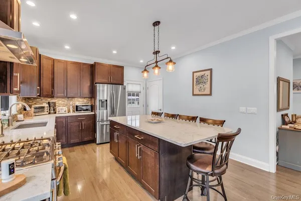 a view of a kitchen and dining area