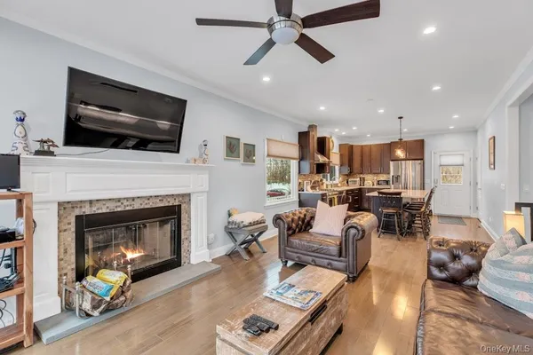a living room with furniture fireplace and flat screen tv