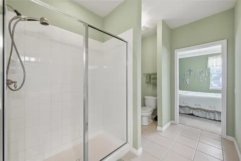 a bathroom with a shower and a mirror