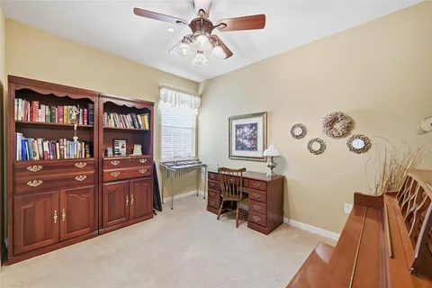 a view of workspace with furniture and cabinet