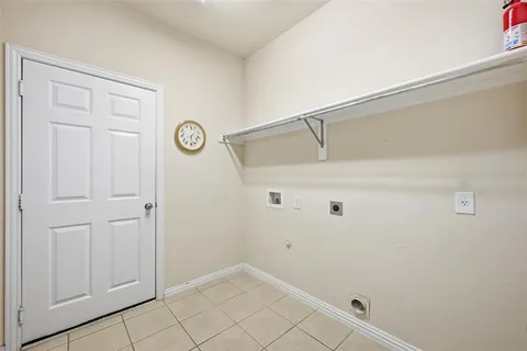 a view of a storage and utility room with closet