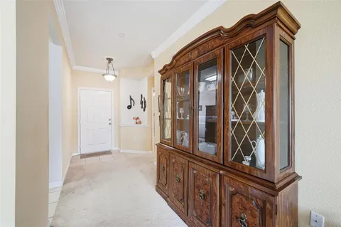 a view of a hallway with wooden floor and entryway