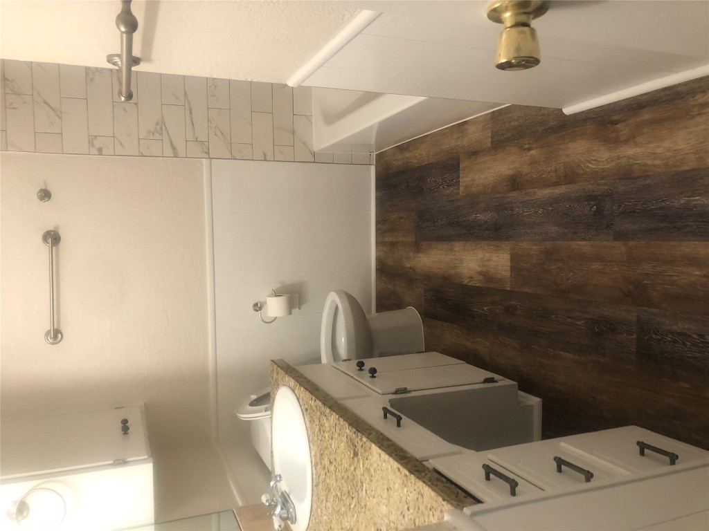 610 Cheyenne Drive Temple, TX 76504 - Photo 7 of 7 a bathroom with a granite countertop sink toilet and shower