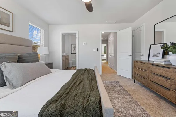 a bedroom with a bed and a couch