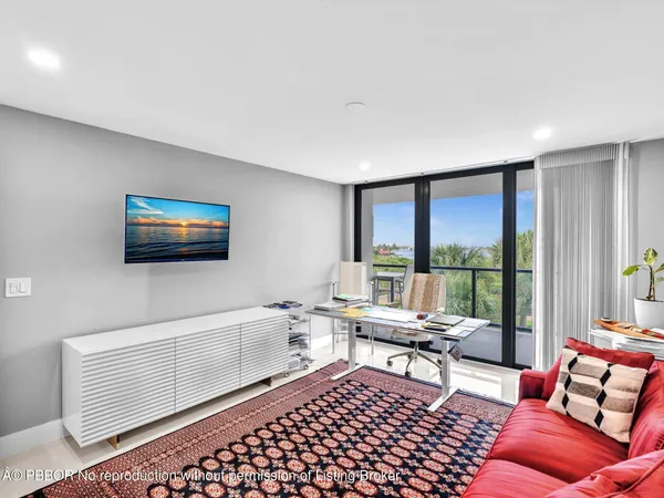 a view of a large building with a yard