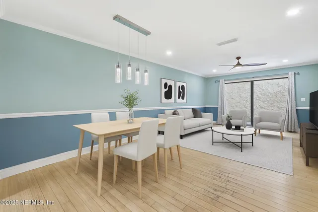 a spacious bedroom with a bed and a ceiling fan