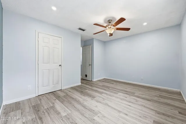 an aerial view of a house with a lake view