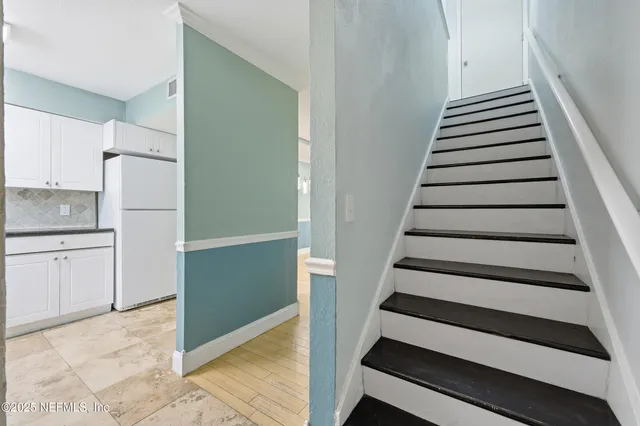 a kitchen with stainless steel appliances granite countertop a sink and a stove