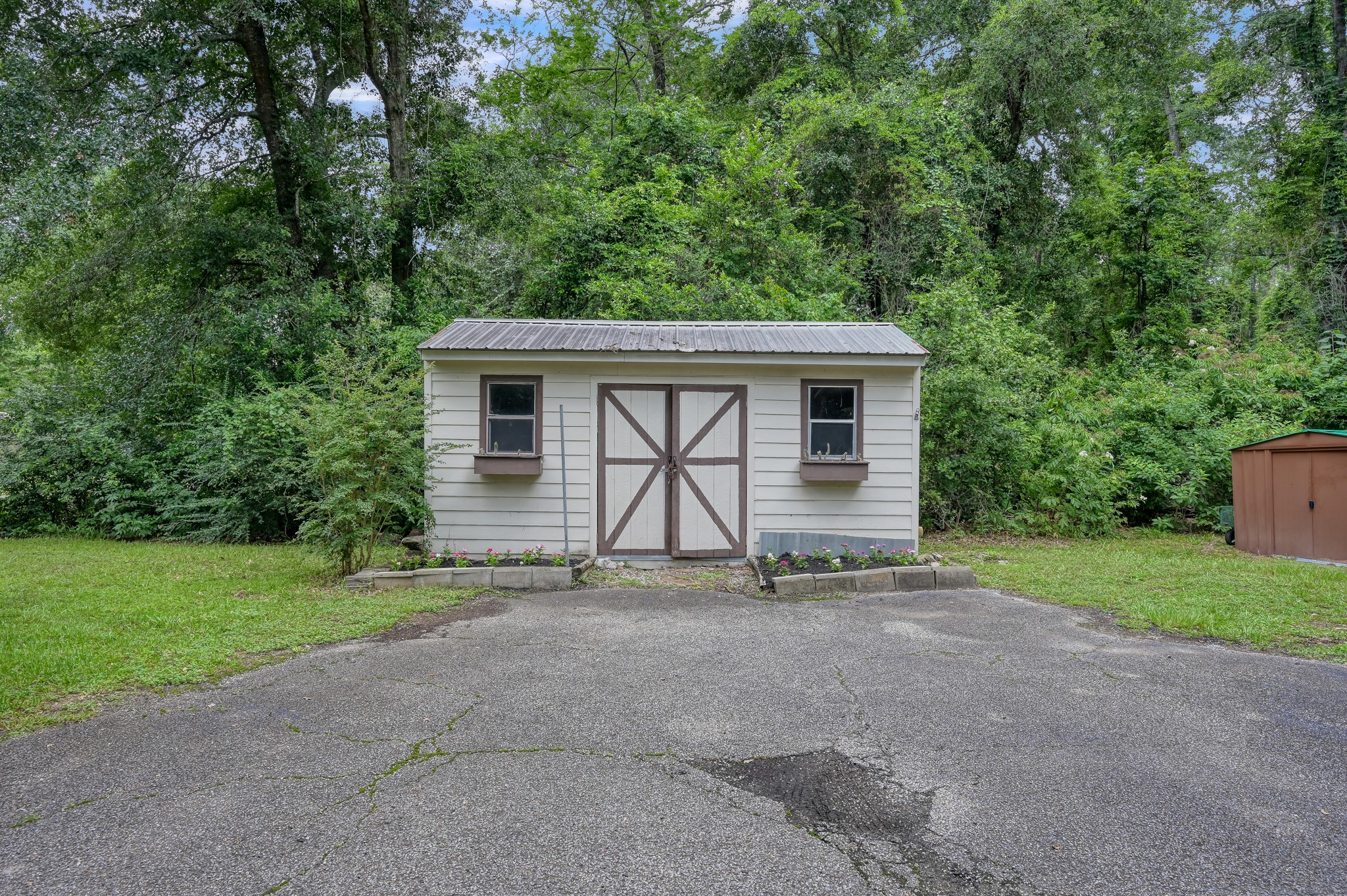 1251 Pruitt Road The Woodlands, TX 77380 - Photo 30 of 36 Garden Shed with windows, shelves and electrical for workshop