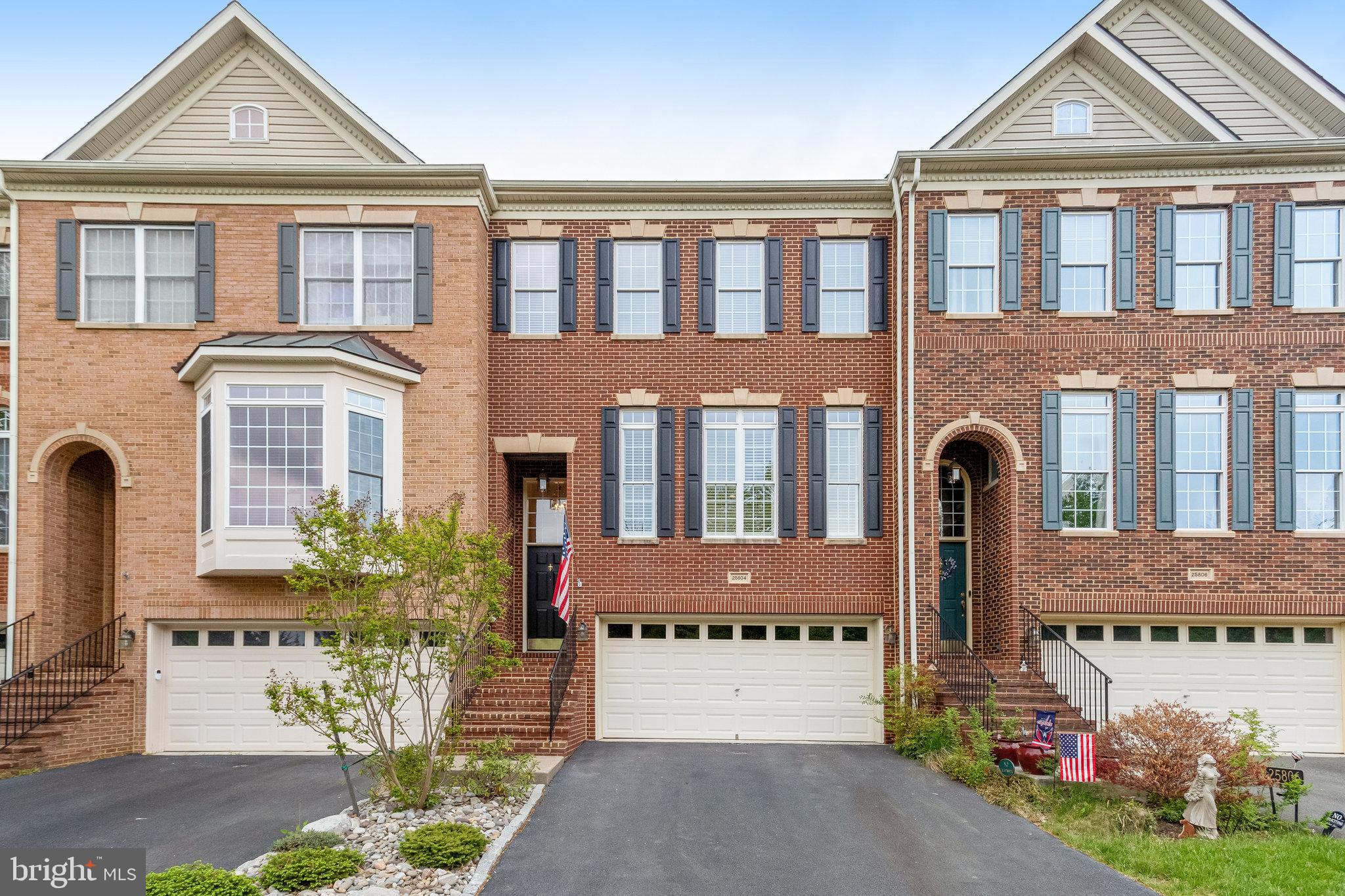 25804 Commons Square Chantilly, VA 20152 - Photo 1 of 48 a front view of a residential apartment building with a yard