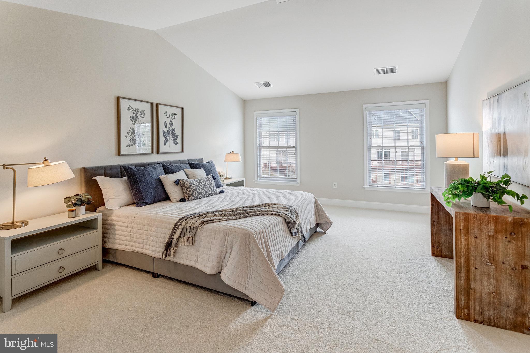 25804 Commons Square Chantilly, VA 20152 - Photo 18 of 48 a spacious bedroom with a bed and a couch