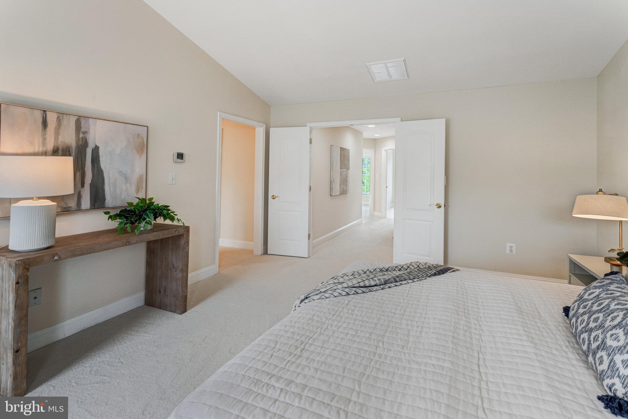 25804 Commons Square Chantilly, VA 20152 - Photo 19 of 48 a bedroom with a large bed and a dresser