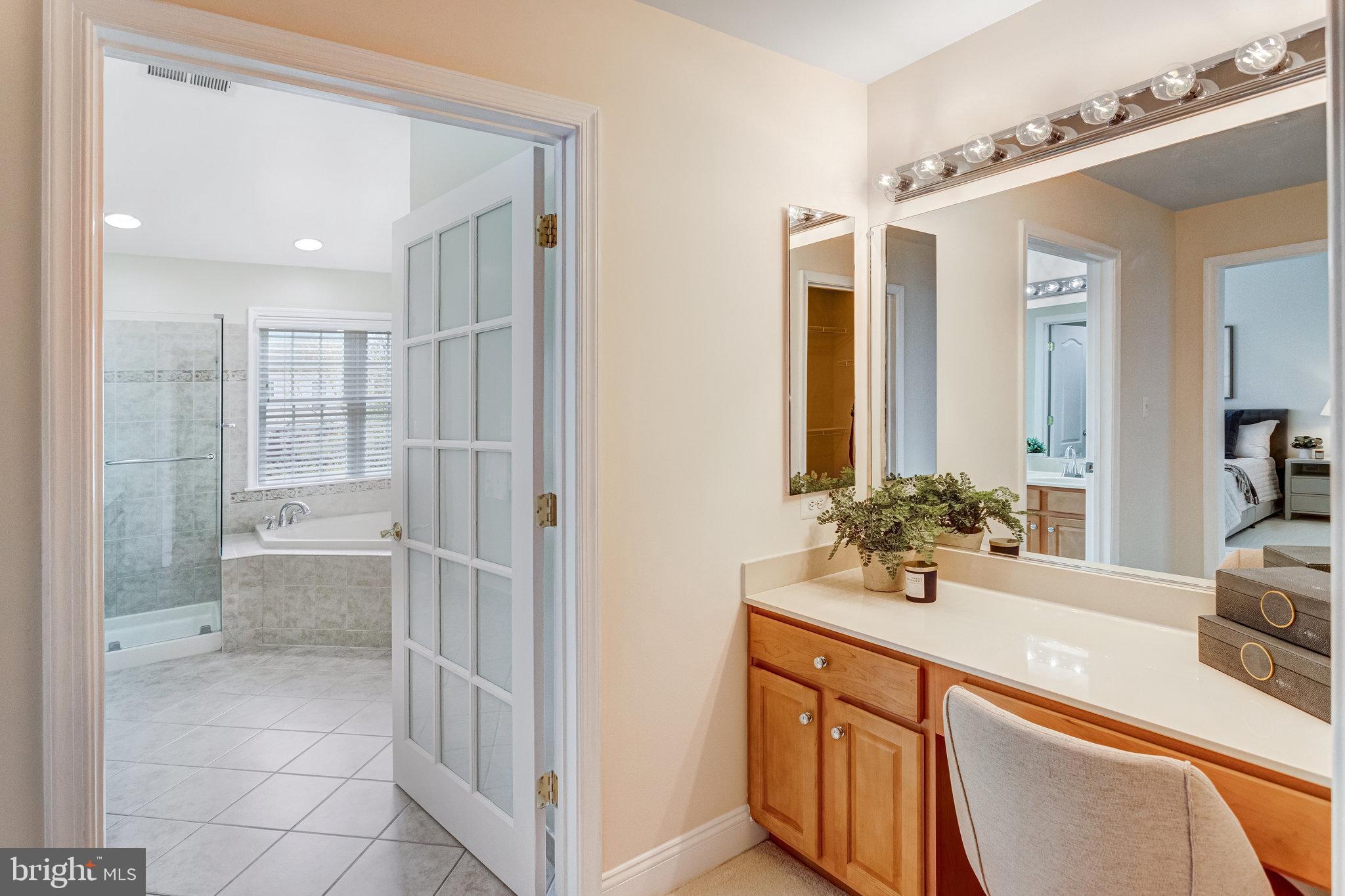 25804 Commons Square Chantilly, VA 20152 - Photo 20 of 48 a bathroom with a double vanity sink mirror and shower