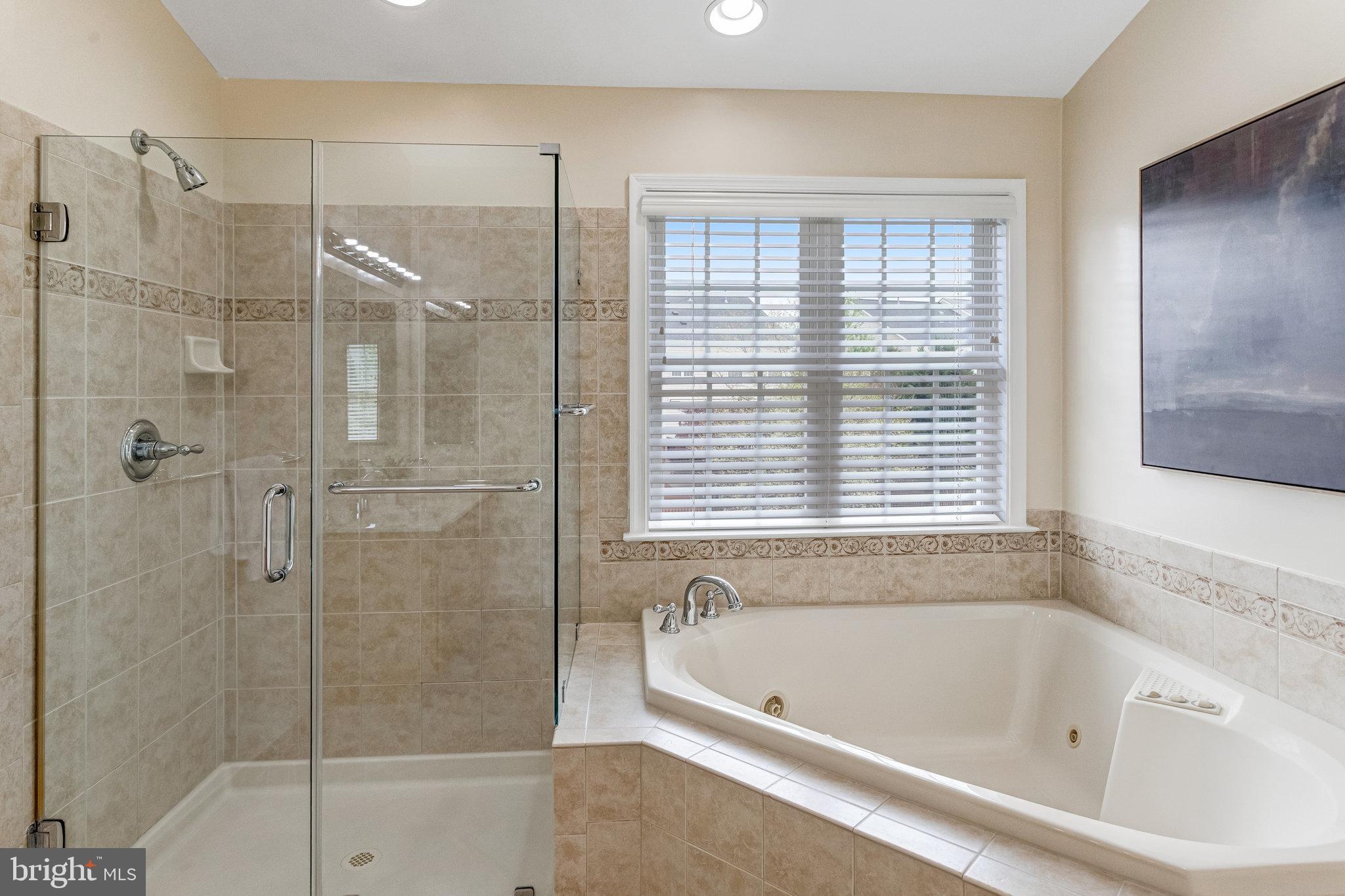 25804 Commons Square Chantilly, VA 20152 - Photo 22 of 48 a bathroom with a bathtub and shower