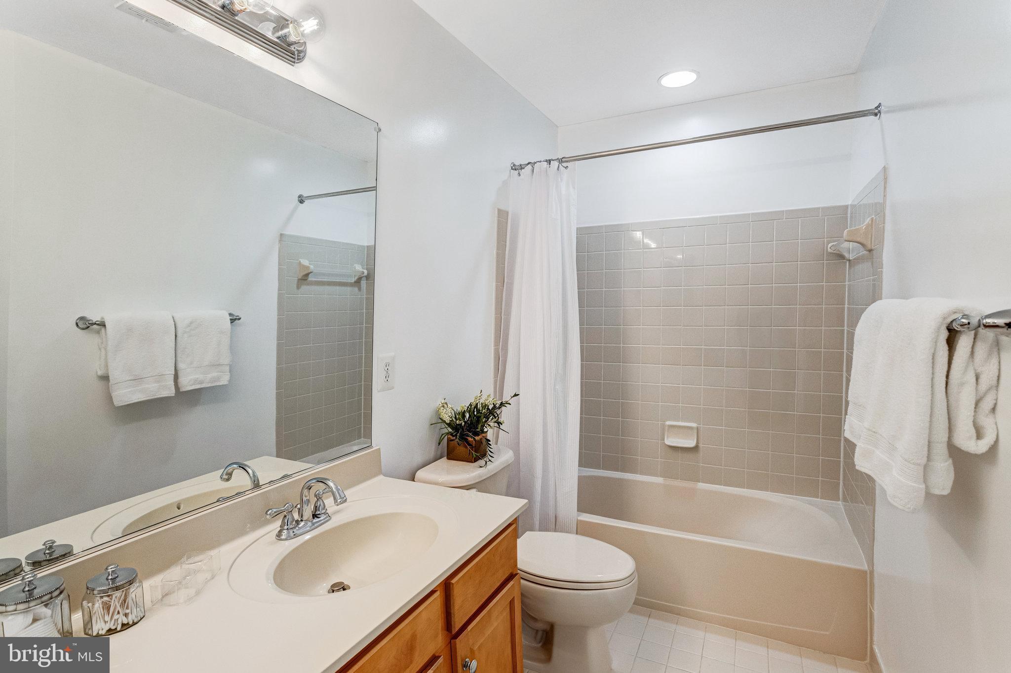 25804 Commons Square Chantilly, VA 20152 - Photo 29 of 48 a bathroom with a sink toilet and shower