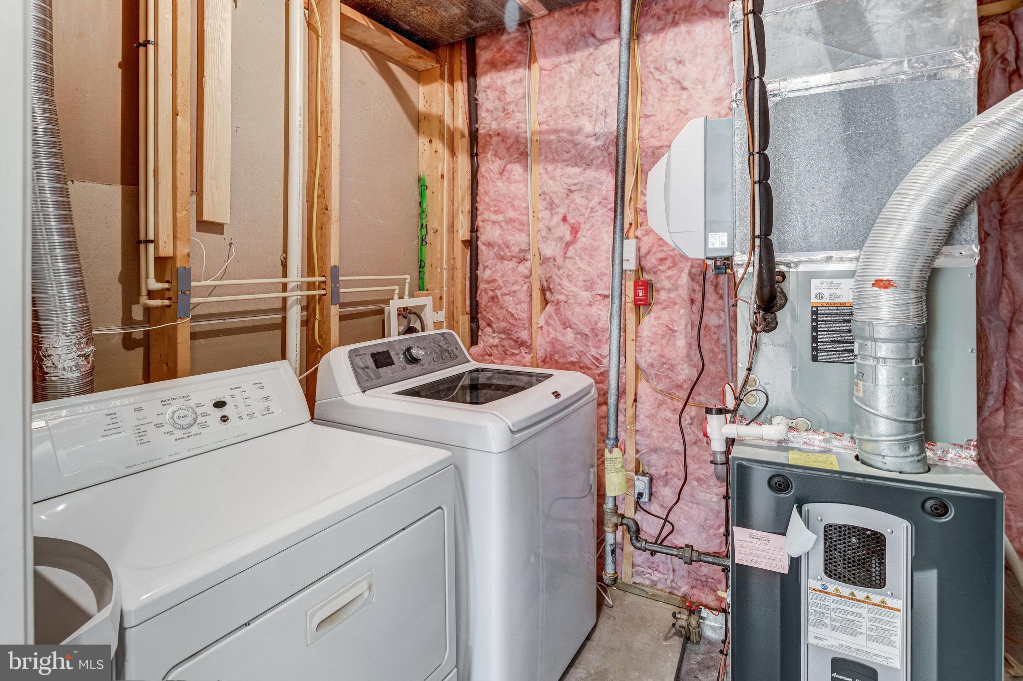 25804 Commons Square Chantilly, VA 20152 - Photo 36 of 48 a utility room with dryer and washer