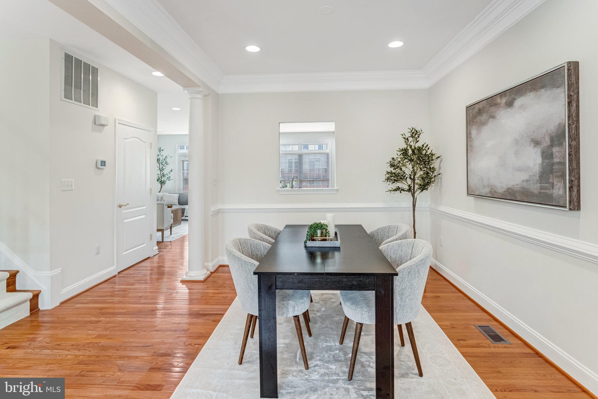 25804 Commons Square Chantilly, VA 20152 - Photo 7 of 48 a view of a dining room with furniture window and wooden floor