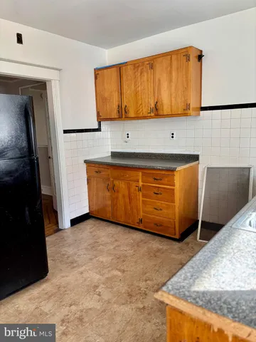 a view of a kitchen with wooden floor