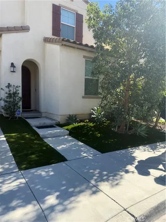 a front view of a house with garden