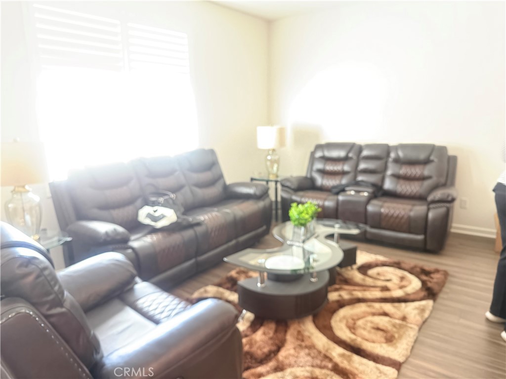 467 West Buttercup Lane Rialto, CA 92376 - Photo 5 of 13 a living room with furniture and a table